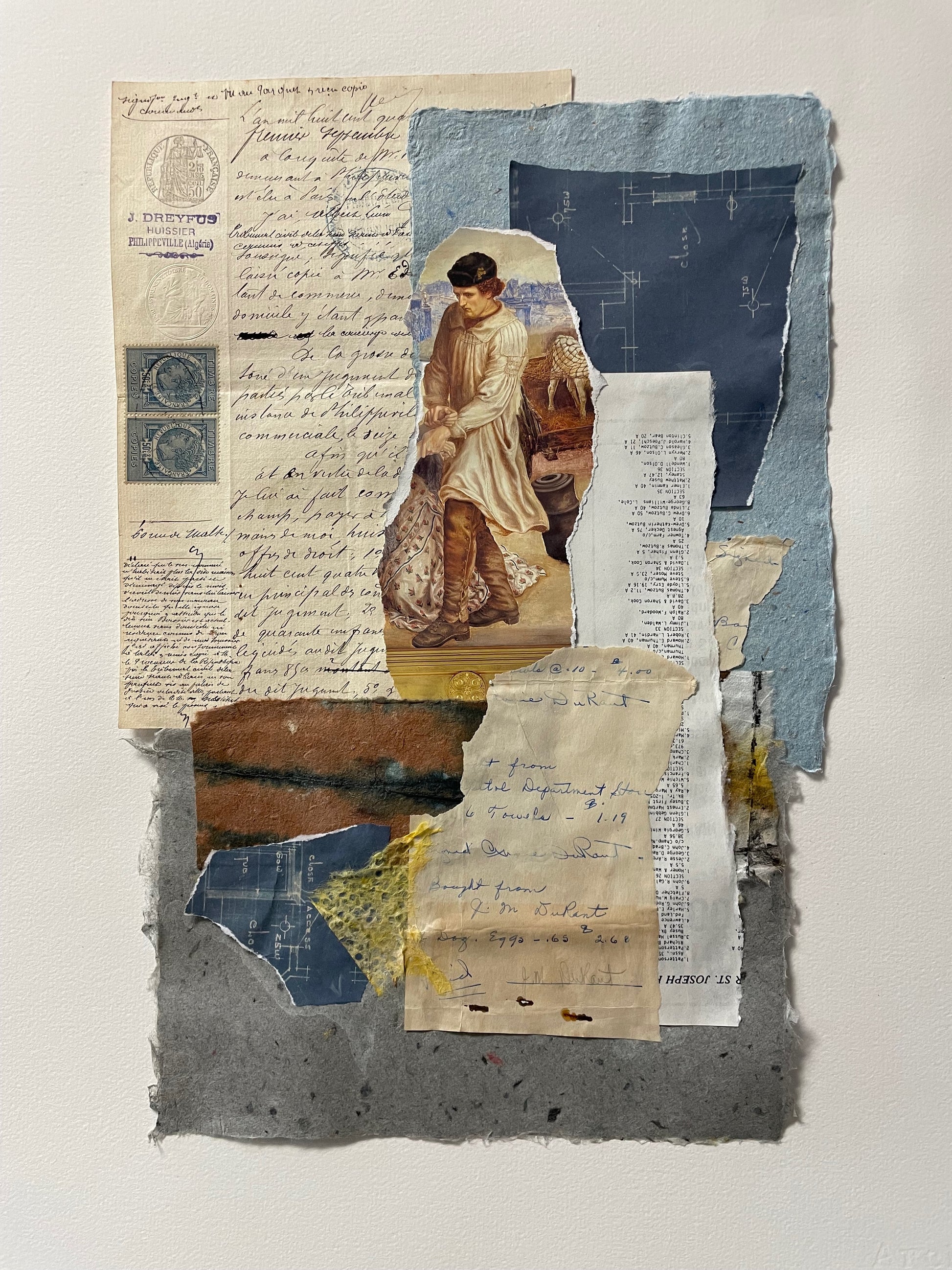 Collage of vintage papers, letters, and a small portrait on a textured surface.
