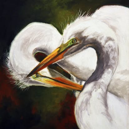 Two white herons with orange beaks against a dark background
