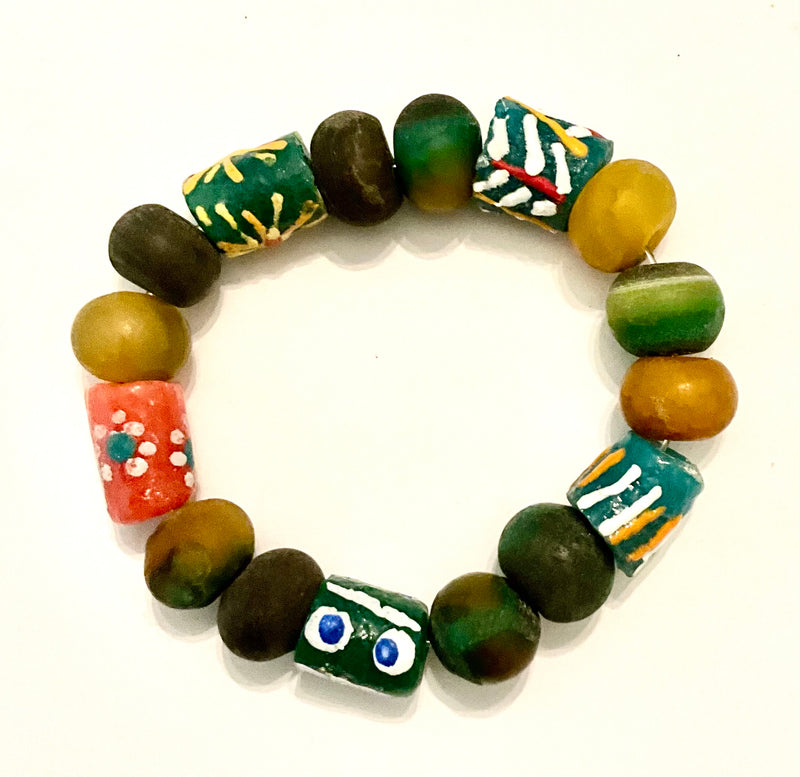 Colorful beaded bracelet with various patterns on a white background
