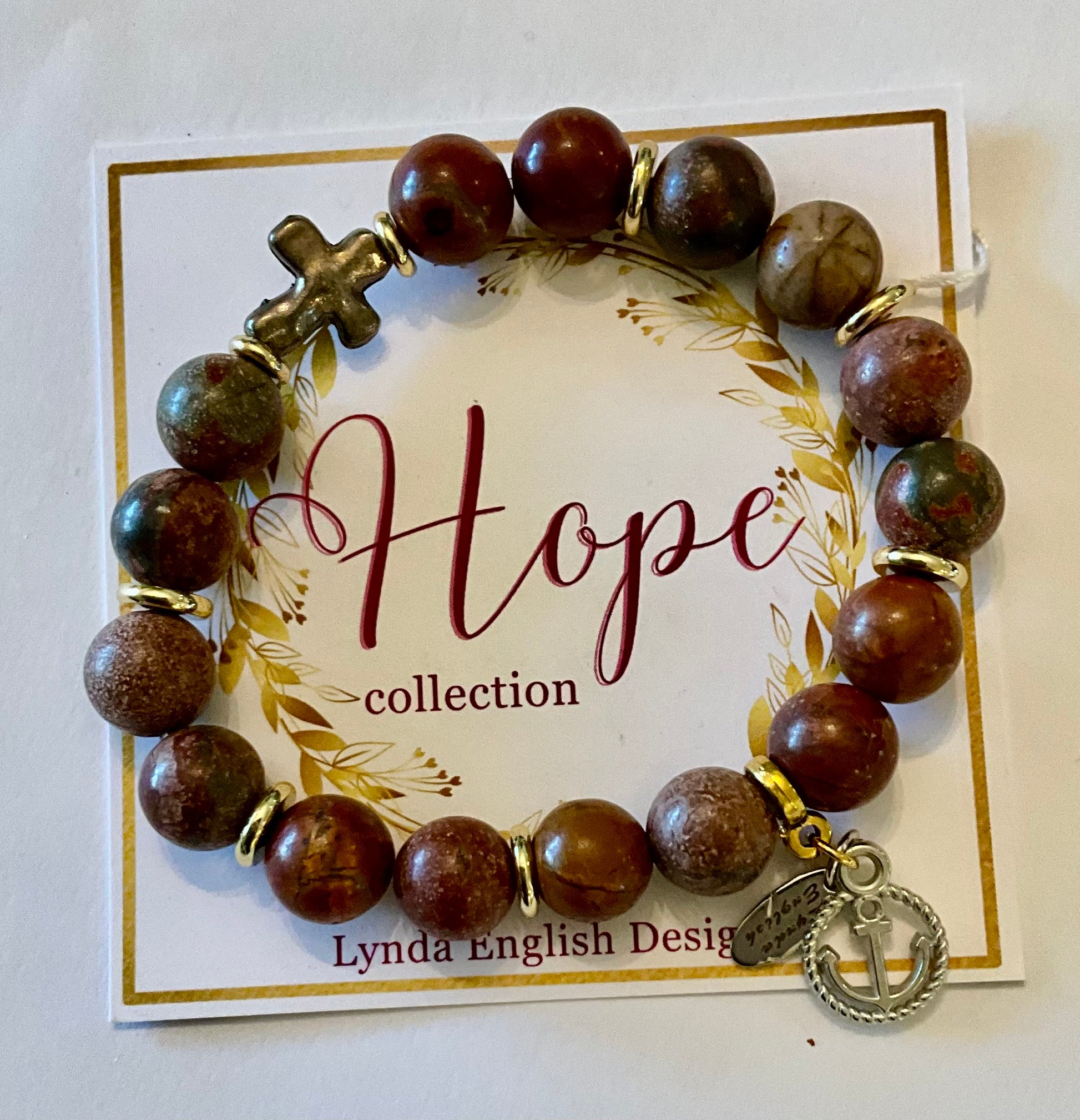 Beaded bracelet with charms on a 'Hope collection' card by Lynda English Design