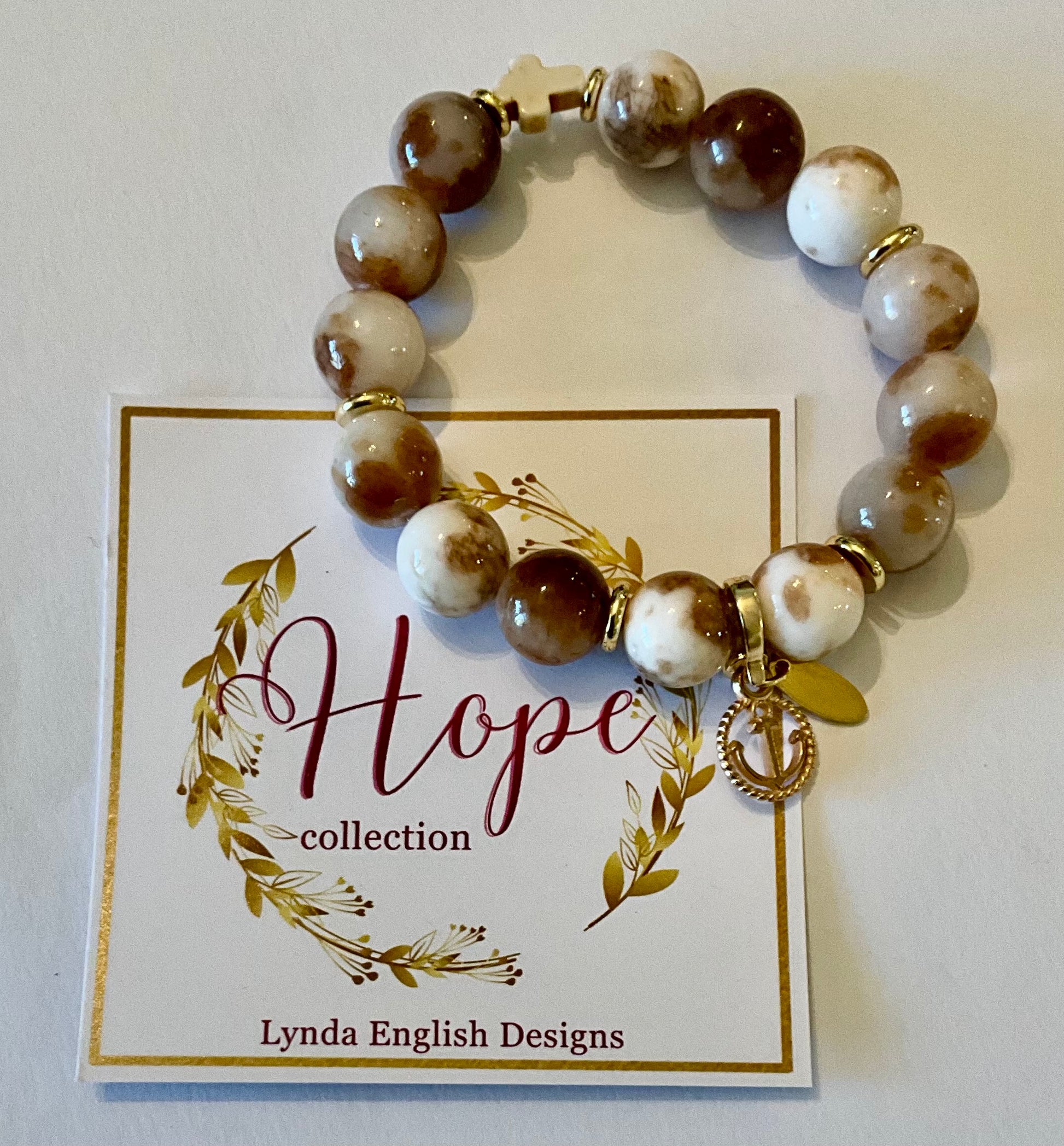 Beaded bracelet with a charm on a 'Hope collection' card by Lynda English Designs