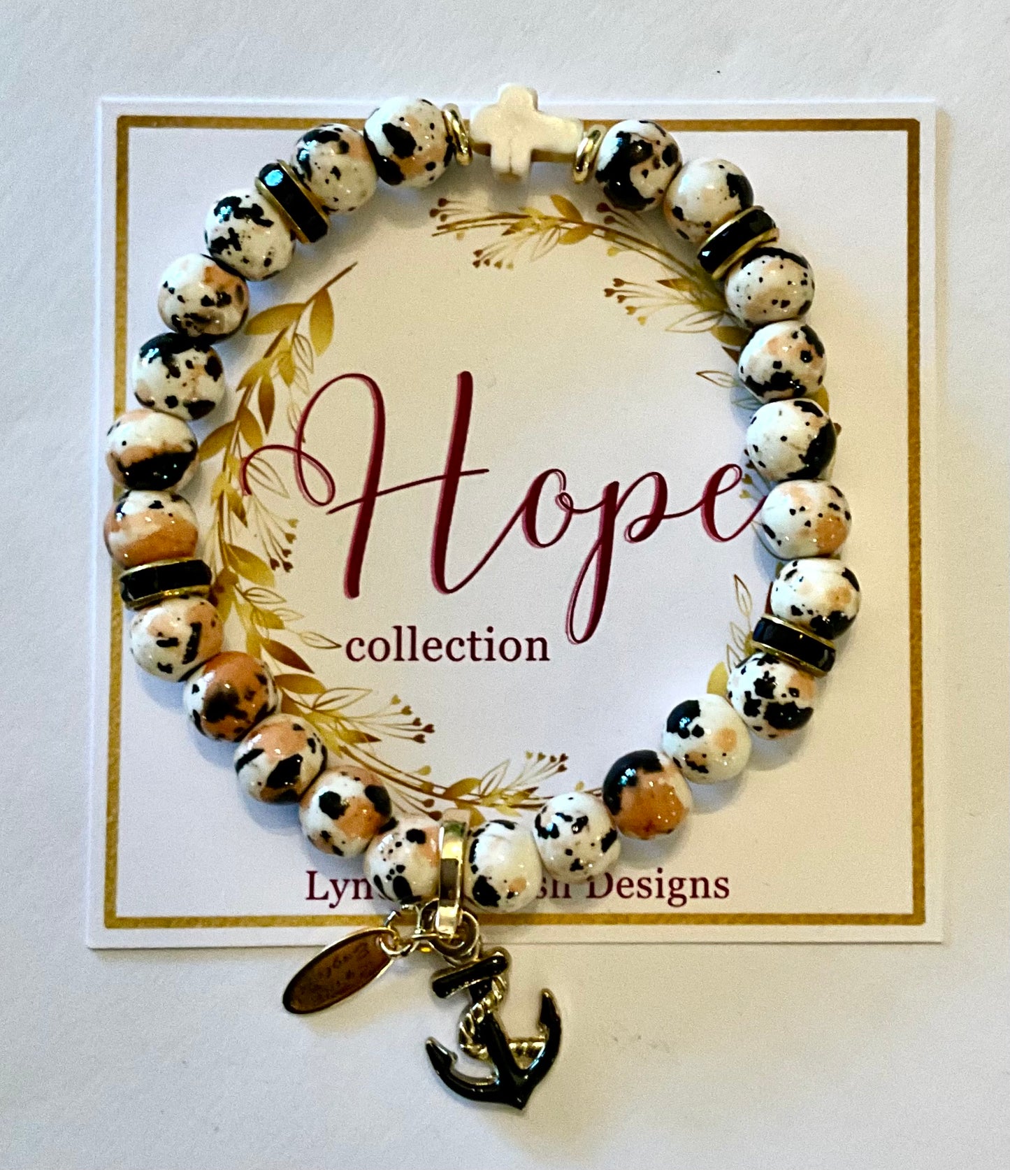 Bracelet with anchor charm on a 'Hope collection' card by Lynne Wilson Designs